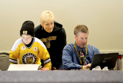 Dave Reed, wife Gerri Anne and young son Jackson from several years ago in the press box before a Colorado College hockey game.